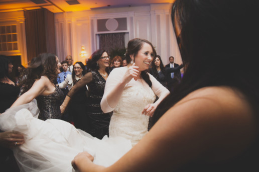 Bride dancing the hora at Jewish wedding