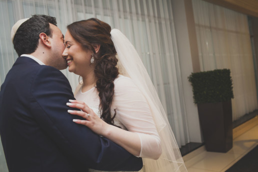Bride and groom embrace during their first look in Montreal