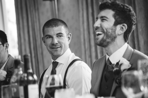 groomsmen listen and laugh during speeches in Banff