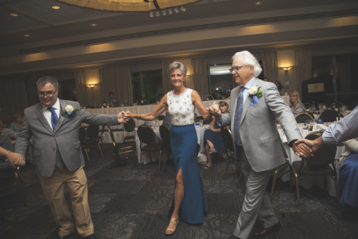 groom and his parents dance the hora at the wedding at the Rimrock Resort and hotel