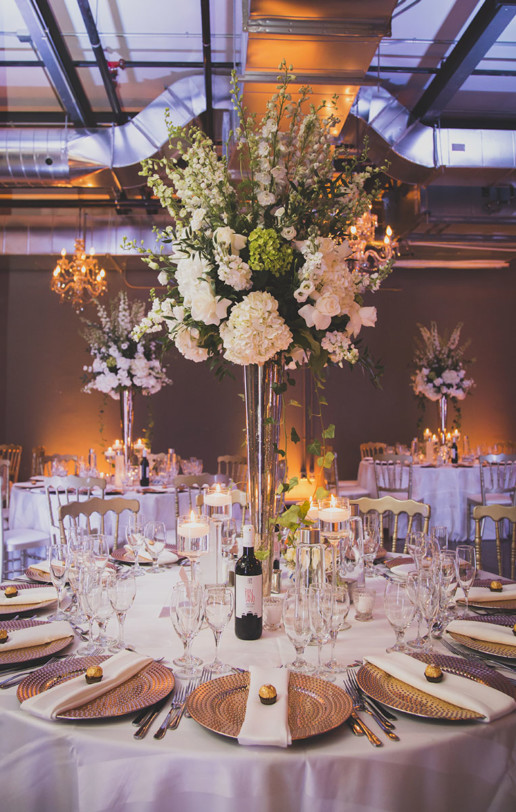 High centerpieces with large florals with lots of greenery and neutral colours is the trend for decor as seen in Montreal at Gare Viger