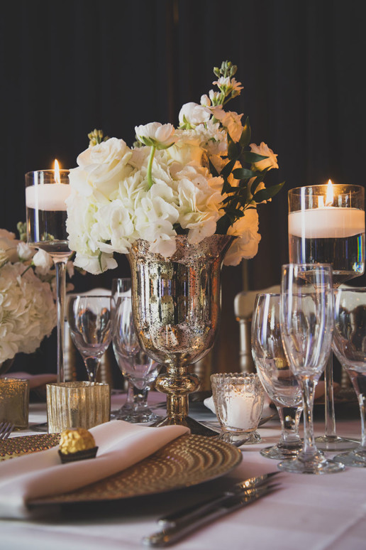 White flowers and metallics and white candles are on trend for a neutral perfect decor at Gare Viger in Montreal