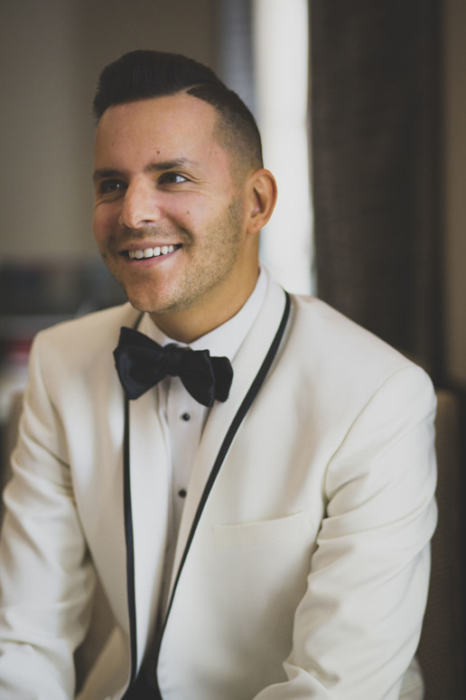 Groom smiles in a candid portrait at the Ritz-Carlton Montreal
