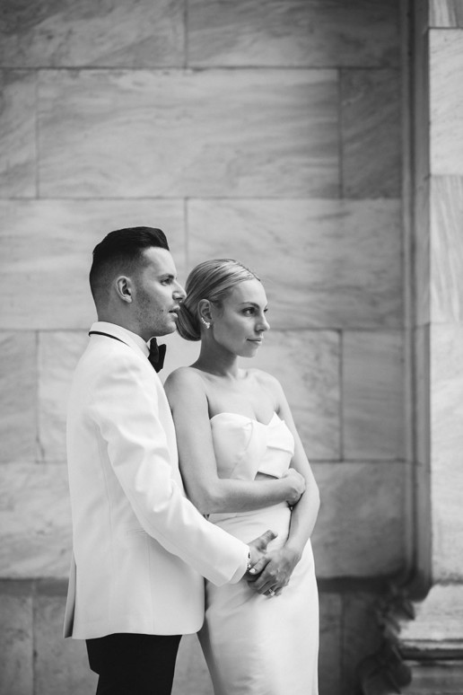 black and white profile portrait of a couple holding each other on their wedding day