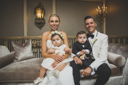 parents and their twin babies dressed for their wedding in Montreal