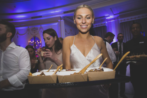 bride serving Moishes Steakhouse poutine for midnight snack at wedding in Oval Room