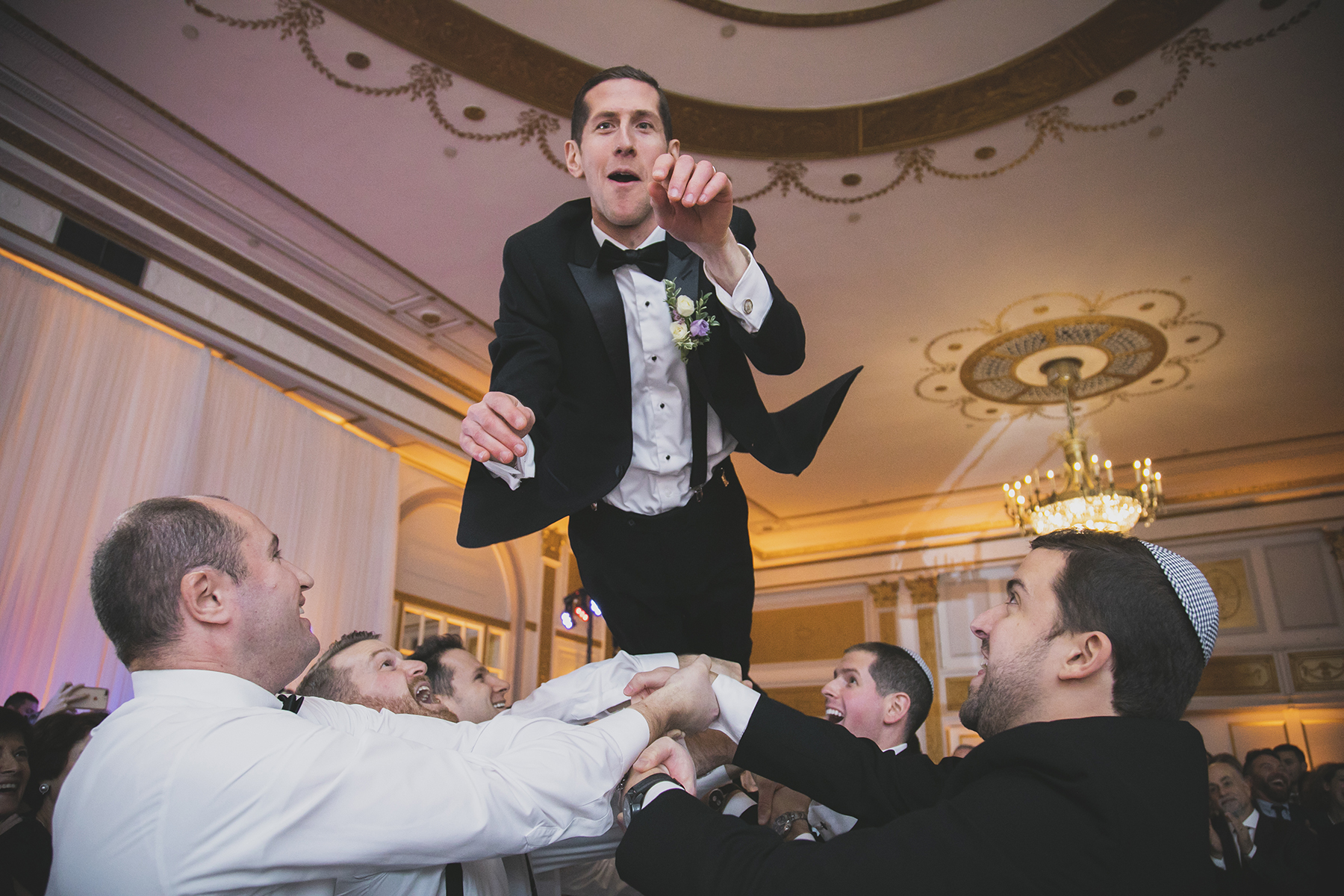 Studio Baron Photo Montreal wedding photographer with groom at a Jewish wedding hora at the Windsor Ballrooms
